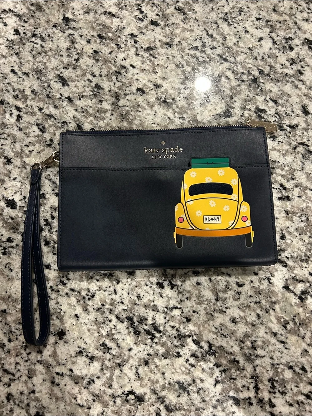 kate spade navy clutch with yellow car graphic